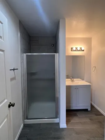 a bathroom with a bathtub and shower