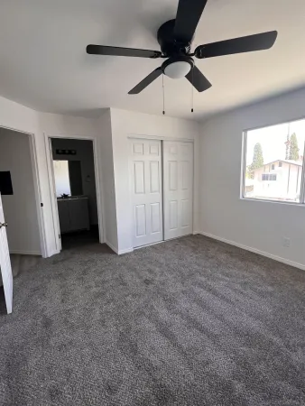 a view of an empty room with a window