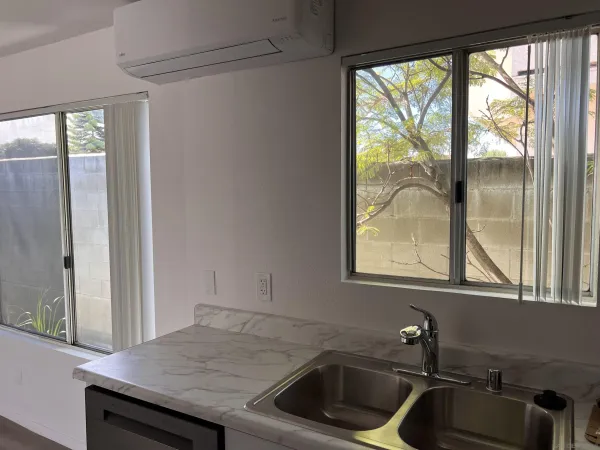 a kitchen with a sink and a window