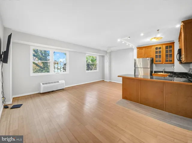 a view of kitchen with furniture and wooden floor