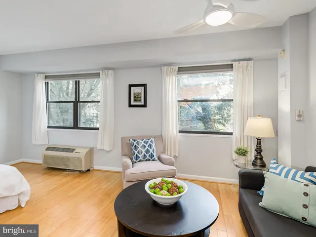 a living room with furniture and a window