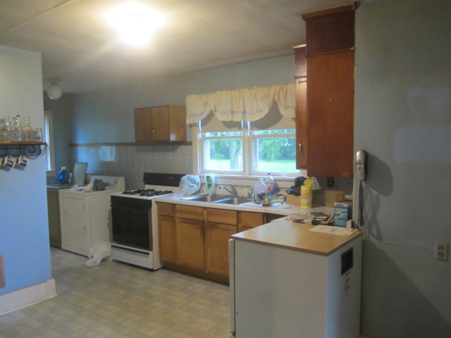 475 North 1900 East Road Milford, IL 60953 - Photo 4 of 10 a kitchen with a sink stove and cabinets