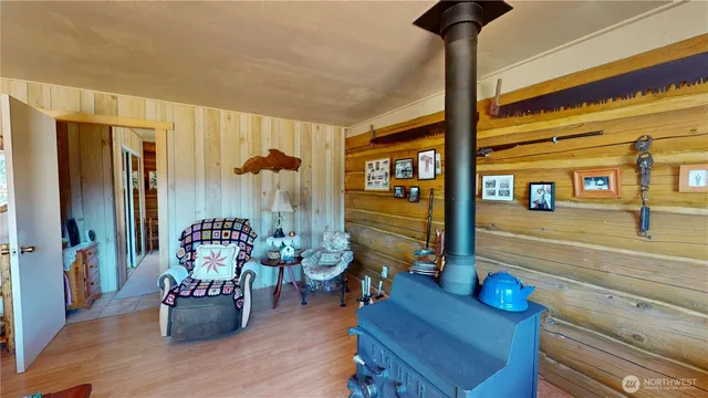 a dining room with furniture and wooden floor