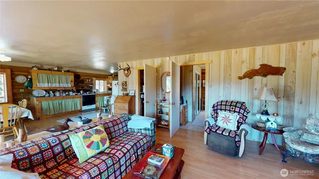 a living room with lots of furniture and wooden floor