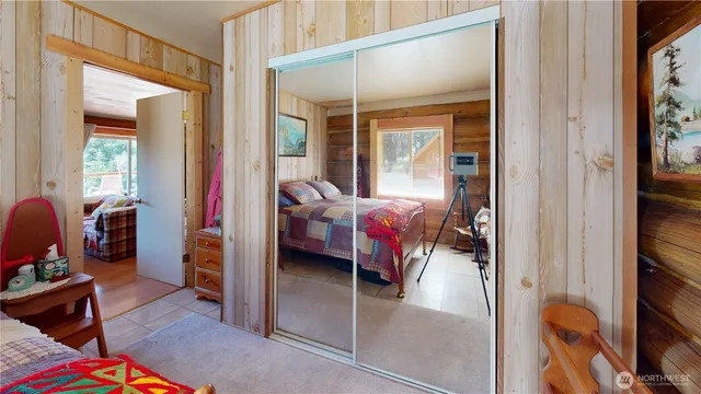 a bed room with furniture and a window