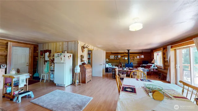 a living room filled with furniture and a wooden floor