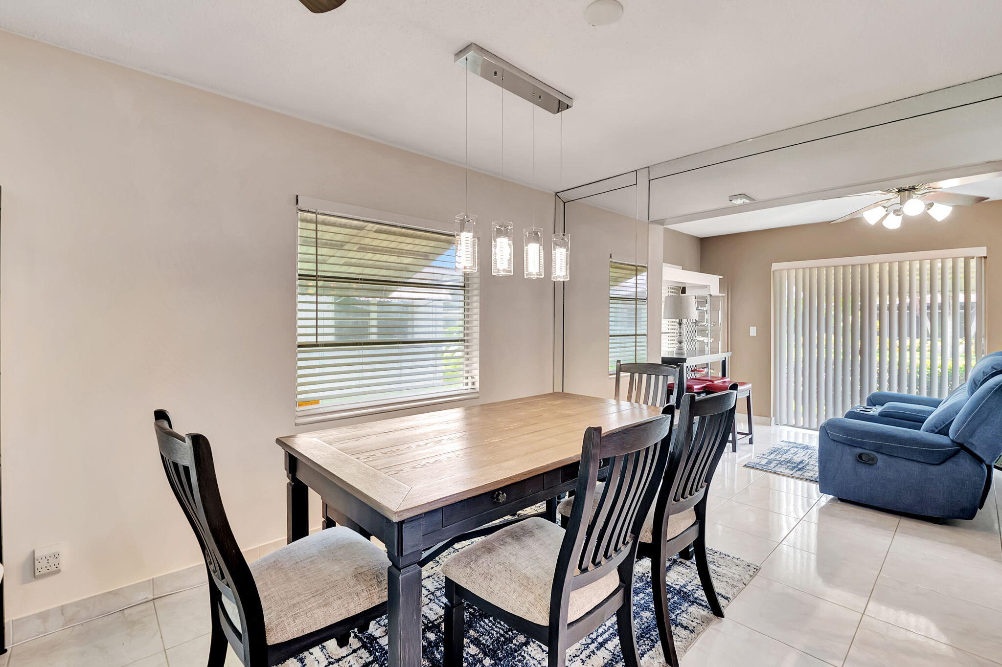 6078 Dusenburg Road Delray Beach, FL 33484 - Photo 14 of 78 a view of a dining room with furniture and window