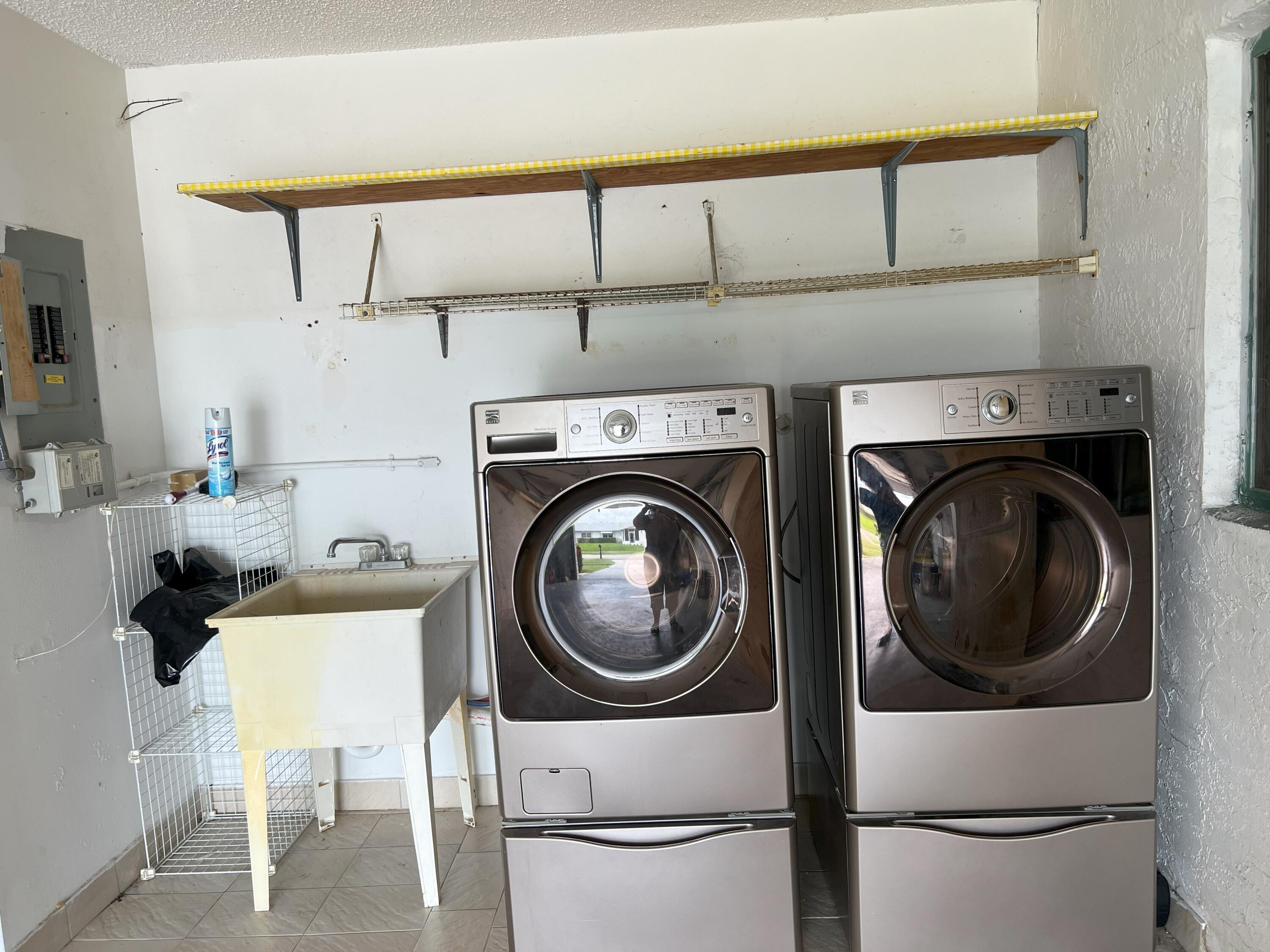 6078 Dusenburg Road Delray Beach, FL 33484 - Photo 27 of 78 a utility room with dryer and washer