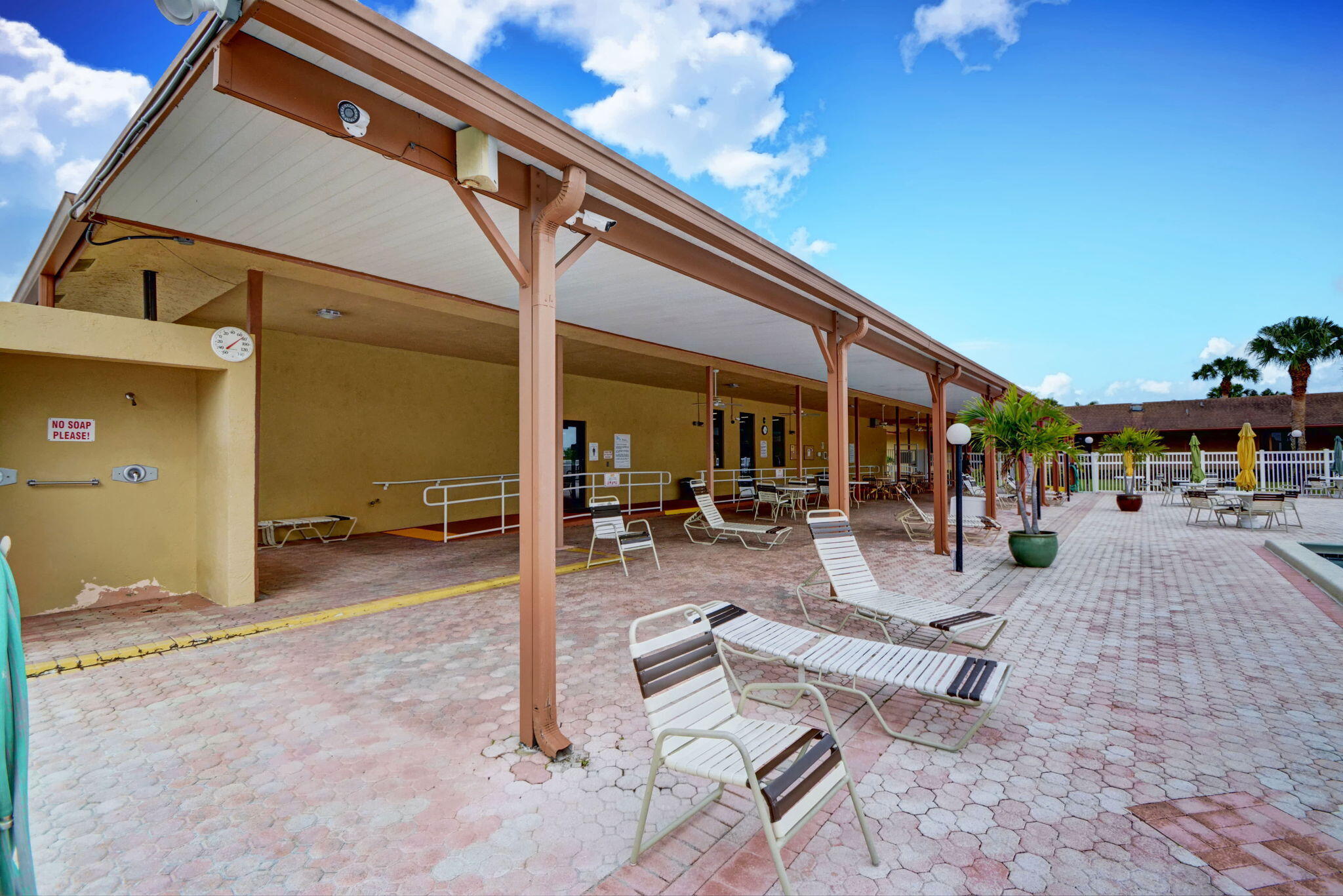 6078 Dusenburg Road Delray Beach, FL 33484 - Photo 46 of 78 a view of a patio with table and chairs