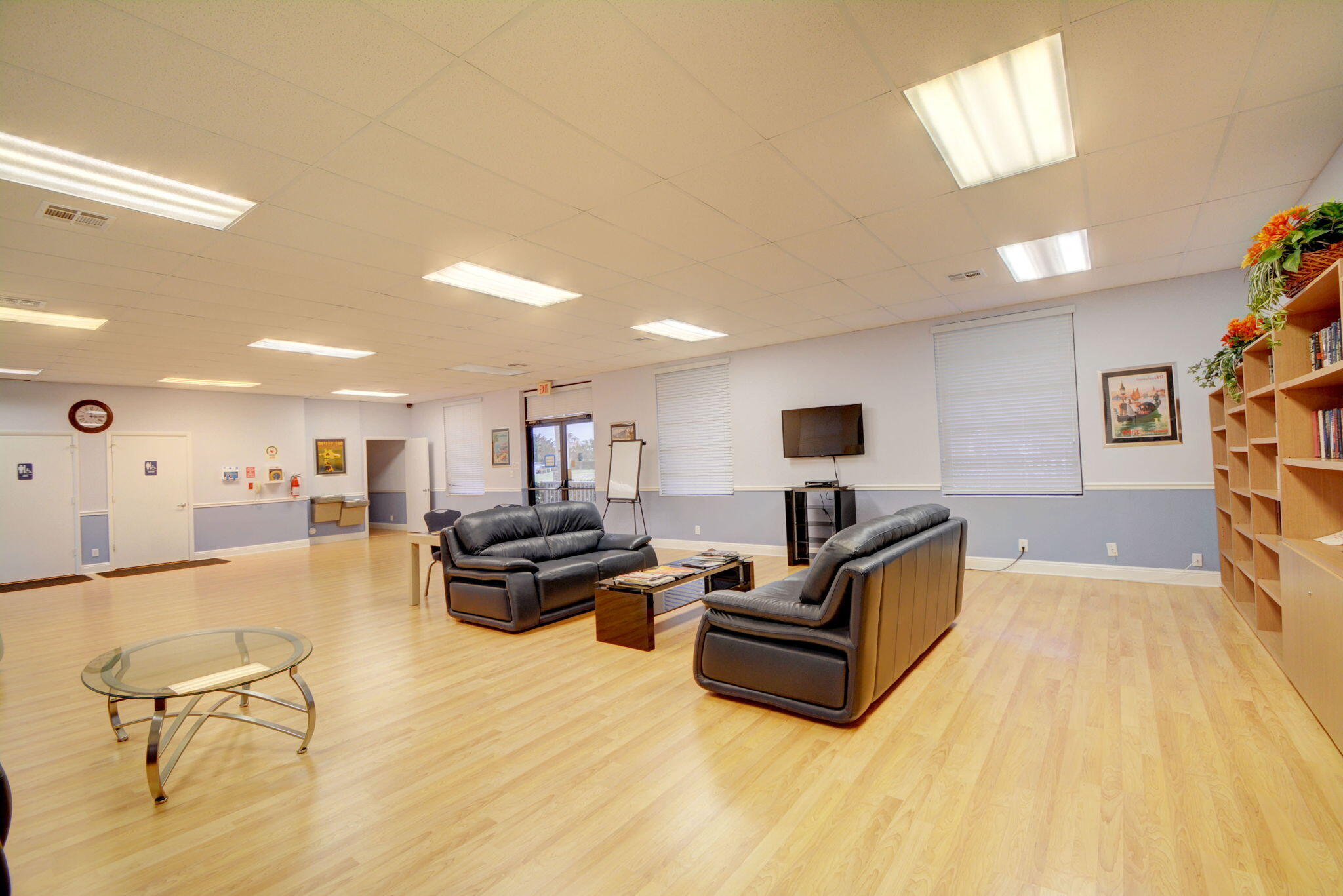6078 Dusenburg Road Delray Beach, FL 33484 - Photo 58 of 78 a living room with furniture and a flat screen tv