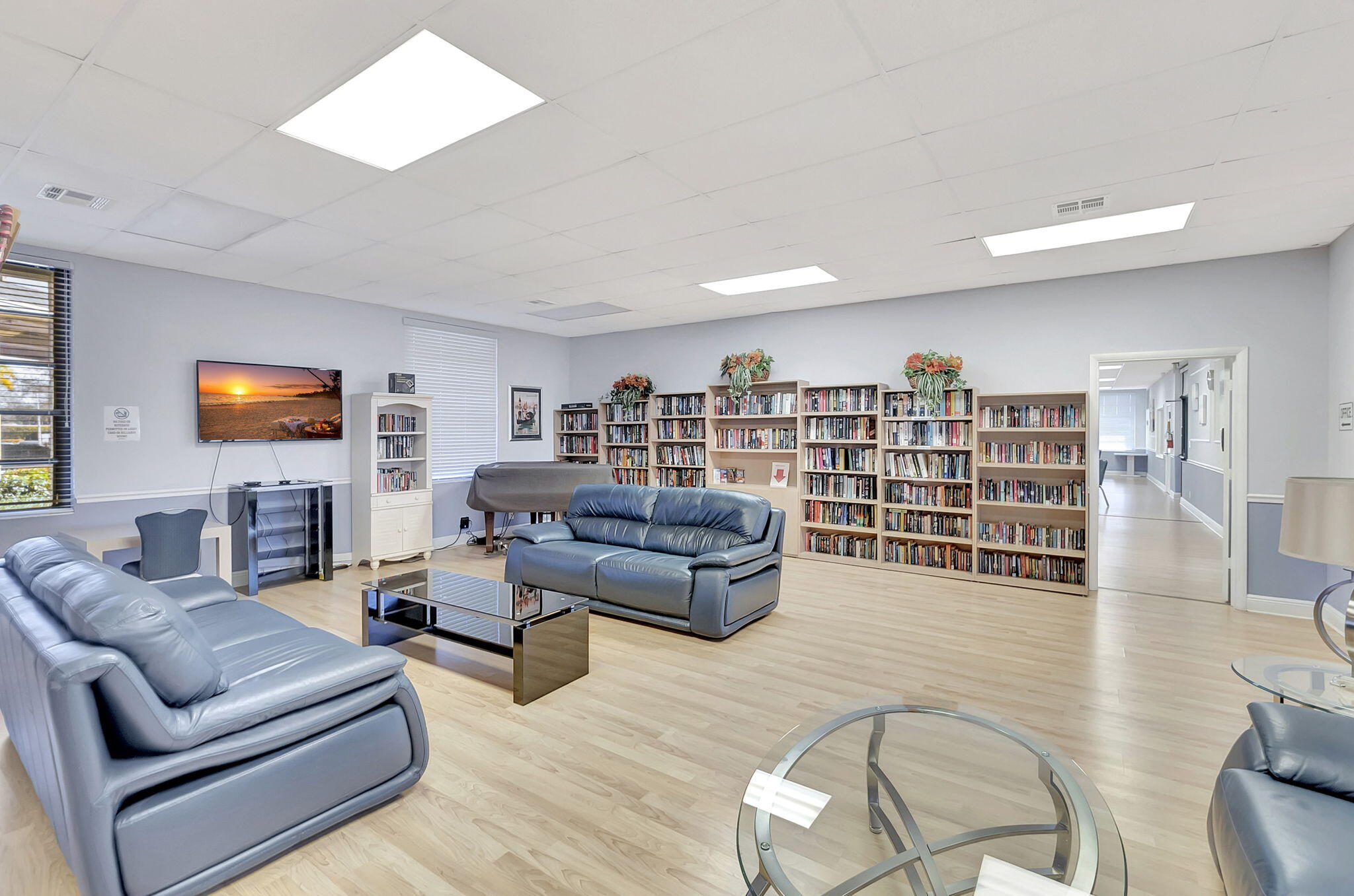 6078 Dusenburg Road Delray Beach, FL 33484 - Photo 77 of 78 a living room with furniture and a flat screen tv