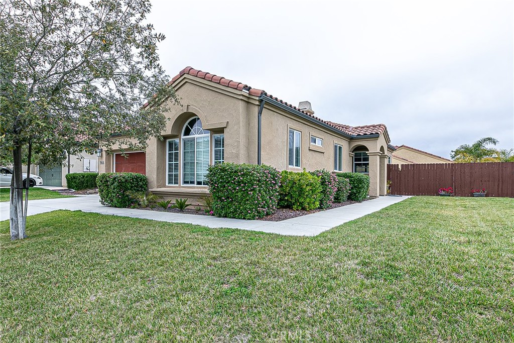 768 Pluto Avenue Lompoc, CA 93436 - Photo 1 of 1 a front view of house with yard and green space