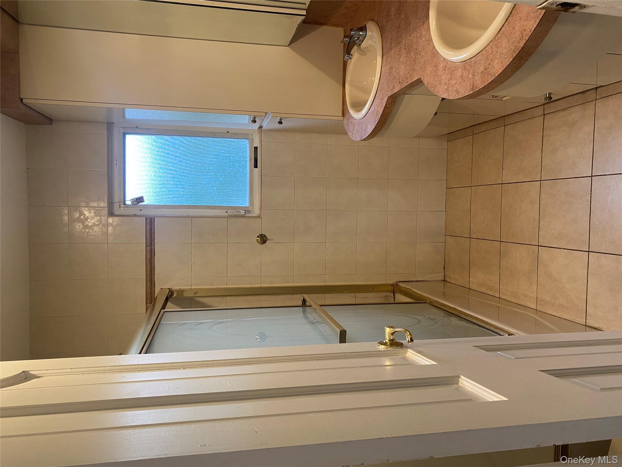 723 Hungry Harbor Road Valley Stream, NY 11581 - Photo 11 of 19 a bathroom with a granite countertop sink toilet and shower