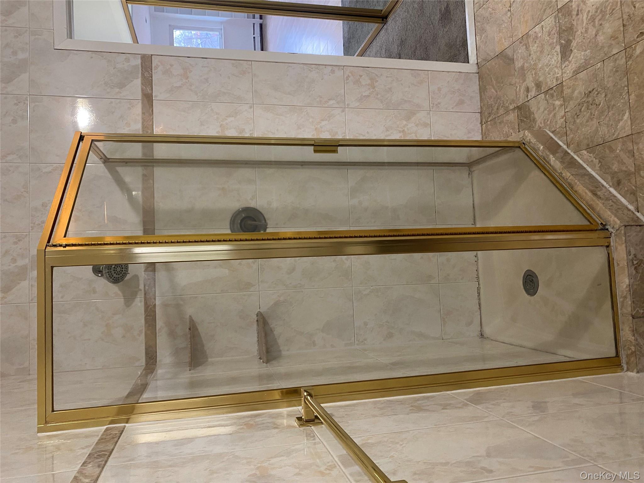 723 Hungry Harbor Road Valley Stream, NY 11581 - Photo 12 of 19 a bathroom with a glass shower door