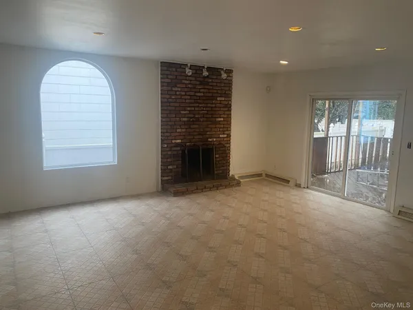 a kitchen with a sink a refrigerator and cabinets