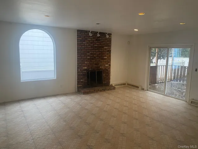 a kitchen with a sink a refrigerator and cabinets