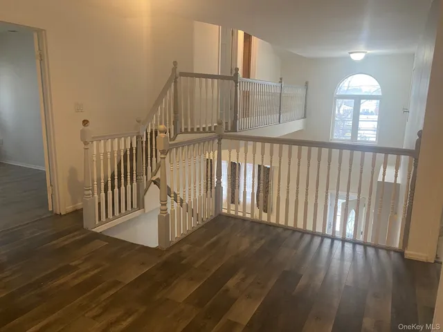 a view of an entryway with wooden floor