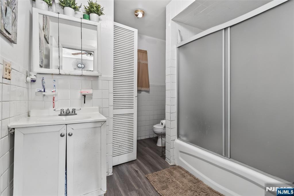 262 Union Avenue Paterson, NJ 07502 - Photo 11 of 17 a bathroom with a sink a toilet and shower