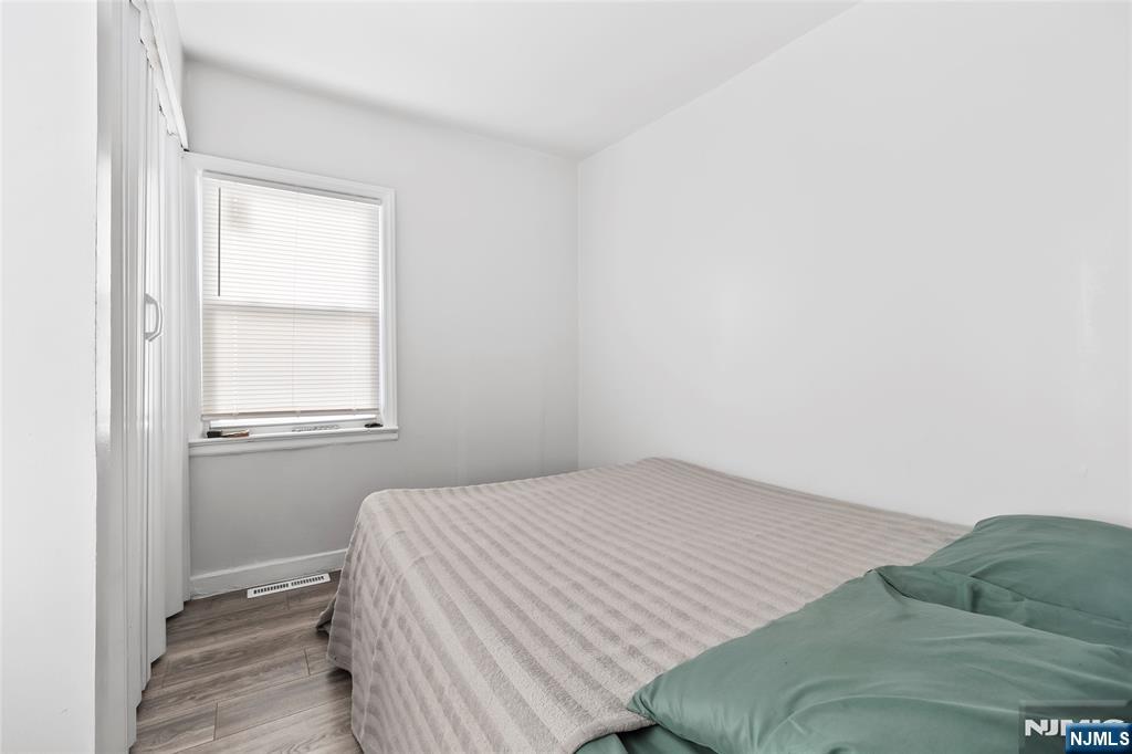 262 Union Avenue Paterson, NJ 07502 - Photo 16 of 17 a bedroom with a bed and a window