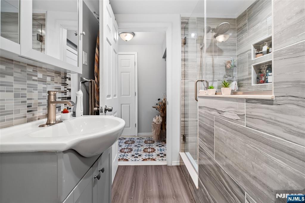 262 Union Avenue Paterson, NJ 07502 - Photo 8 of 17 a bathroom with a sink a toilet a mirror and shower