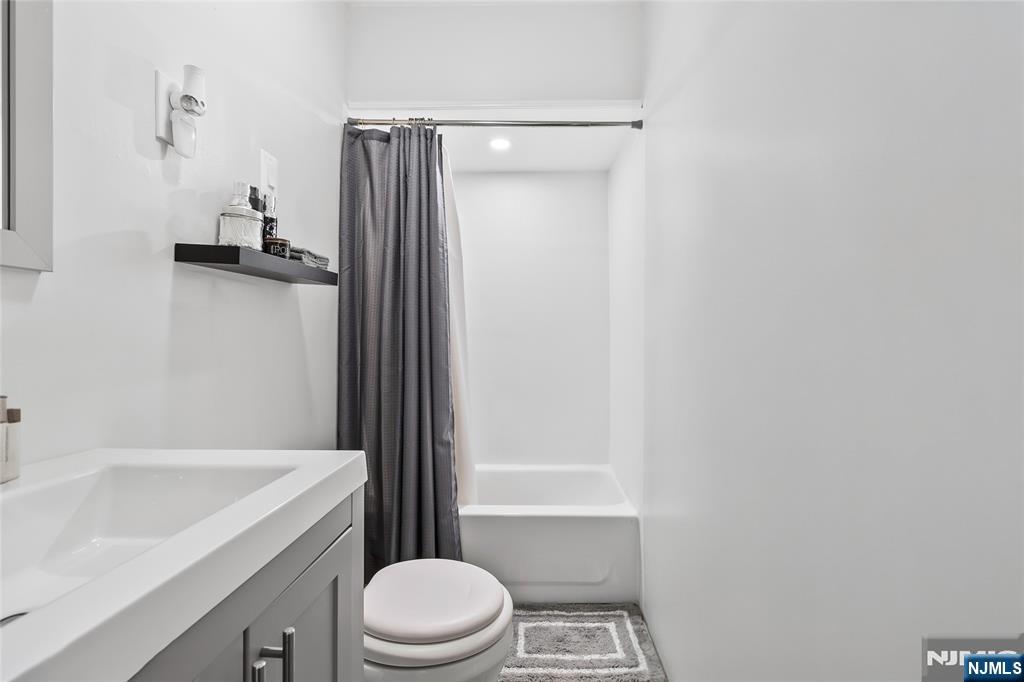 262 Union Avenue Paterson, NJ 07502 - Photo 10 of 17 a bathroom with a sink a toilet and shower