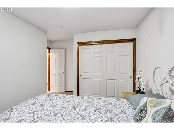 a bedroom with a bed and a dresser