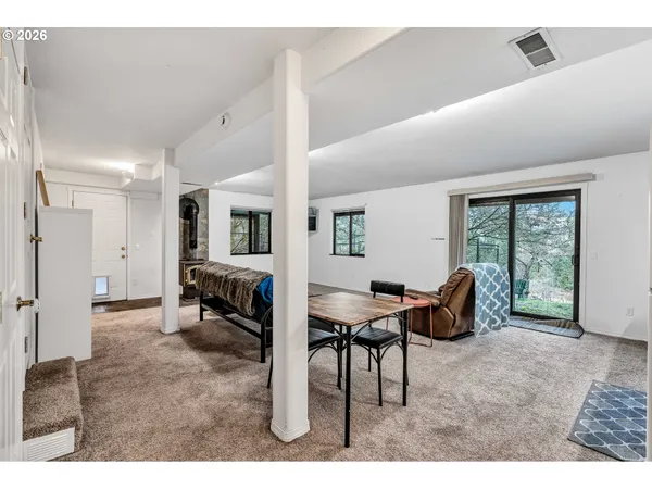 a living room with furniture and a table