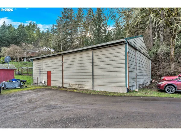 a view of a house with a yard and garage
