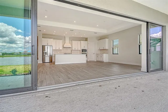a view of a kitchen with a sink and cabinets