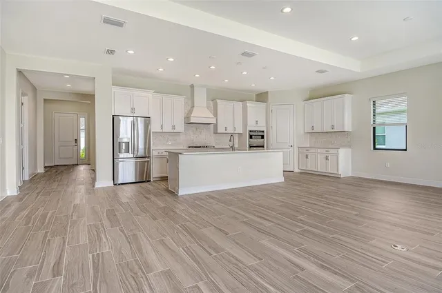 a view of kitchen with wooden floor and window