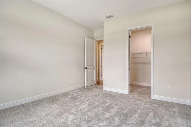 an empty room with closet area