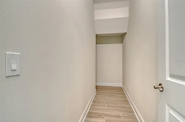 a view of a livingroom with furniture and a ceiling fan