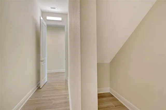 a view of a house with backyard and porch