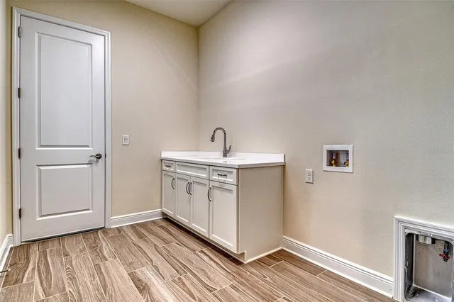 a house view with swimming pool and garden space