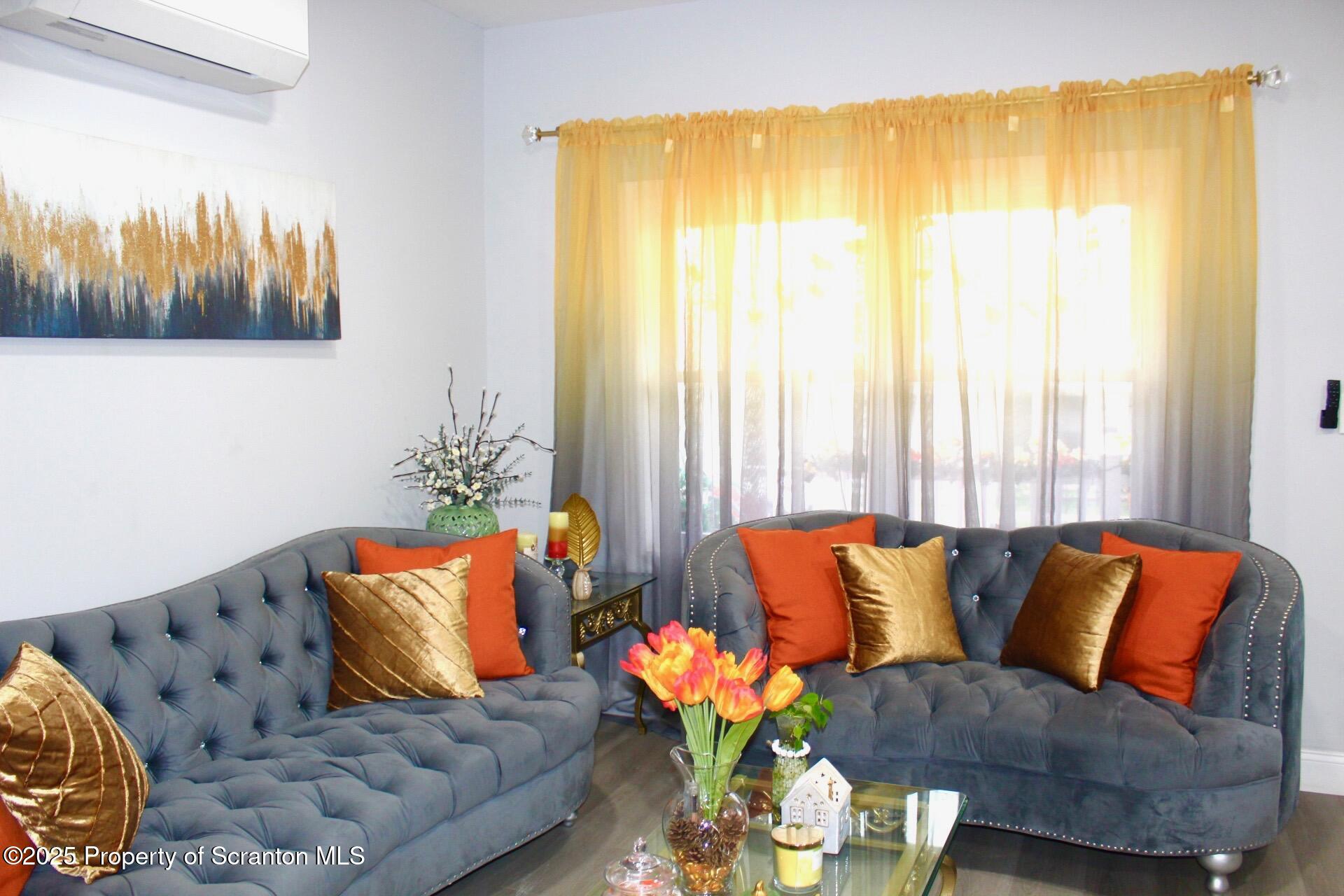 260 East Broad Street Nanticoke, PA 18634 - Photo 2 of 19 a living room with furniture and a large window