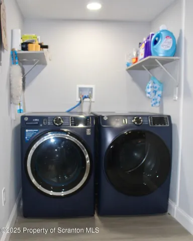 a bathroom with a toilet a sink and a mirror