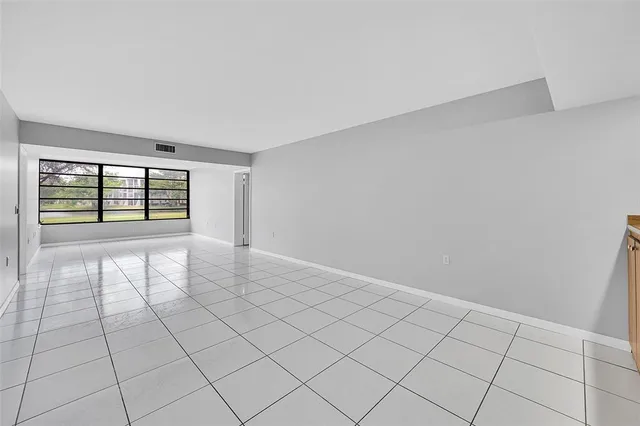 a view of an empty room and window