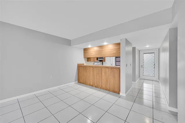 a view of a room with a projector and furniture