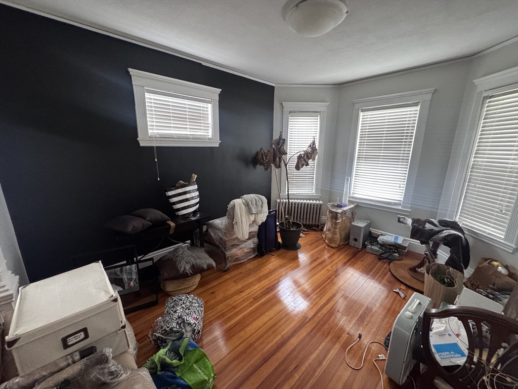 40 Arbutus Street, Unit 3 Boston, MA 02124 - Photo 8 of 8 a bedroom with furniture and a window