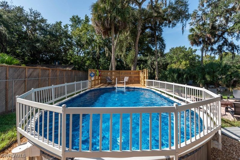 236 Mastadon Drive Inglis, FL 34449 - Photo 11 of 21 a view of balcony with wooden fence