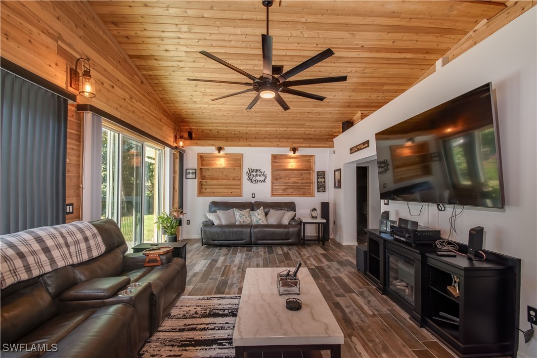 236 Mastadon Drive Inglis, FL 34449 - Photo 5 of 21 a living room with furniture and a flat screen tv