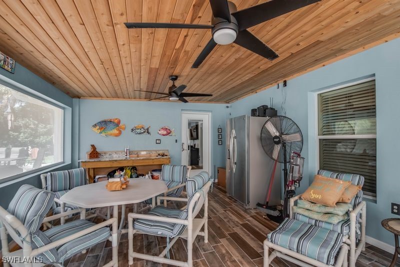 236 Mastadon Drive Inglis, FL 34449 - Photo 8 of 21 a view of a dining room with furniture a chandelier and wooden floor