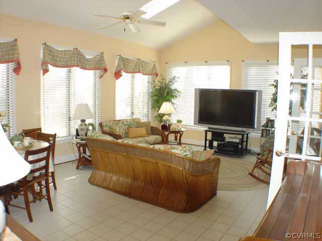 14401 Newgate Road Midlothian, VA 23113 - Photo 7 of 10 a living room with furniture and a flat screen tv