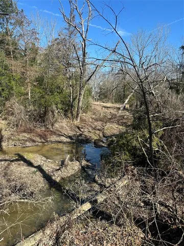 a backyard of a house with a yard covered with snow