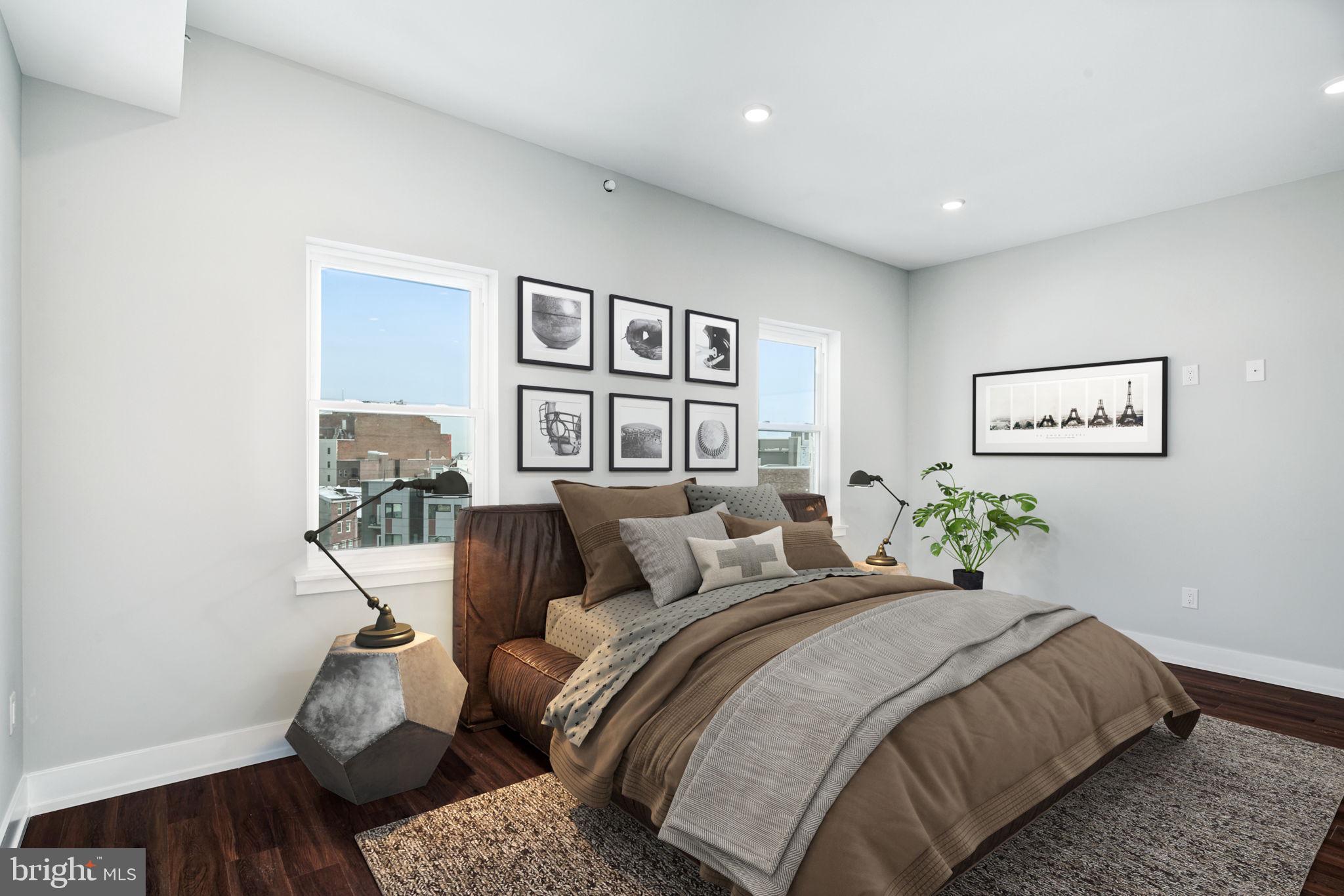 1527-29 Ridge Avenue, Unit 3A Philadelphia, PA 19130 - Photo 15 of 33 a bedroom with a bed and a painting on the wall