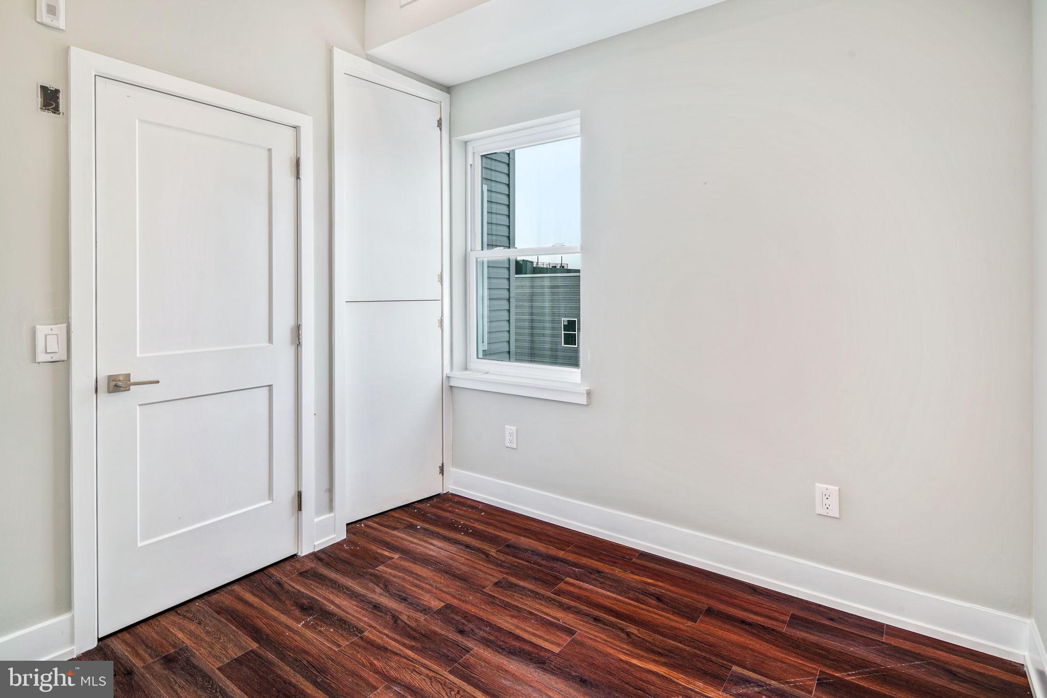 1527-29 Ridge Avenue, Unit 3A Philadelphia, PA 19130 - Photo 16 of 33 a view of a room with wooden floor and entryway