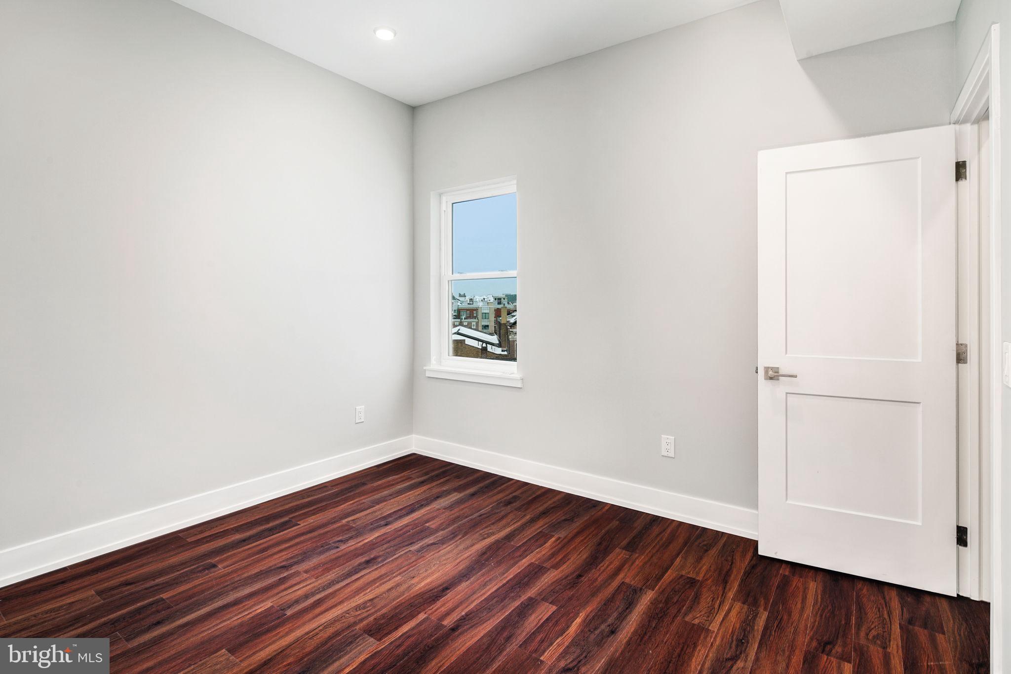 1527-29 Ridge Avenue, Unit 3A Philadelphia, PA 19130 - Photo 18 of 33 a view of an empty room with wooden floor