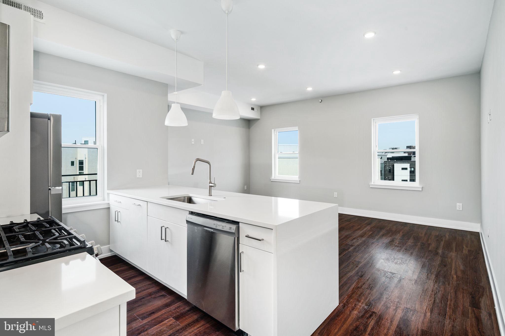 1527-29 Ridge Avenue, Unit 3A Philadelphia, PA 19130 - Photo 2 of 33 a kitchen with a sink and a stove top oven