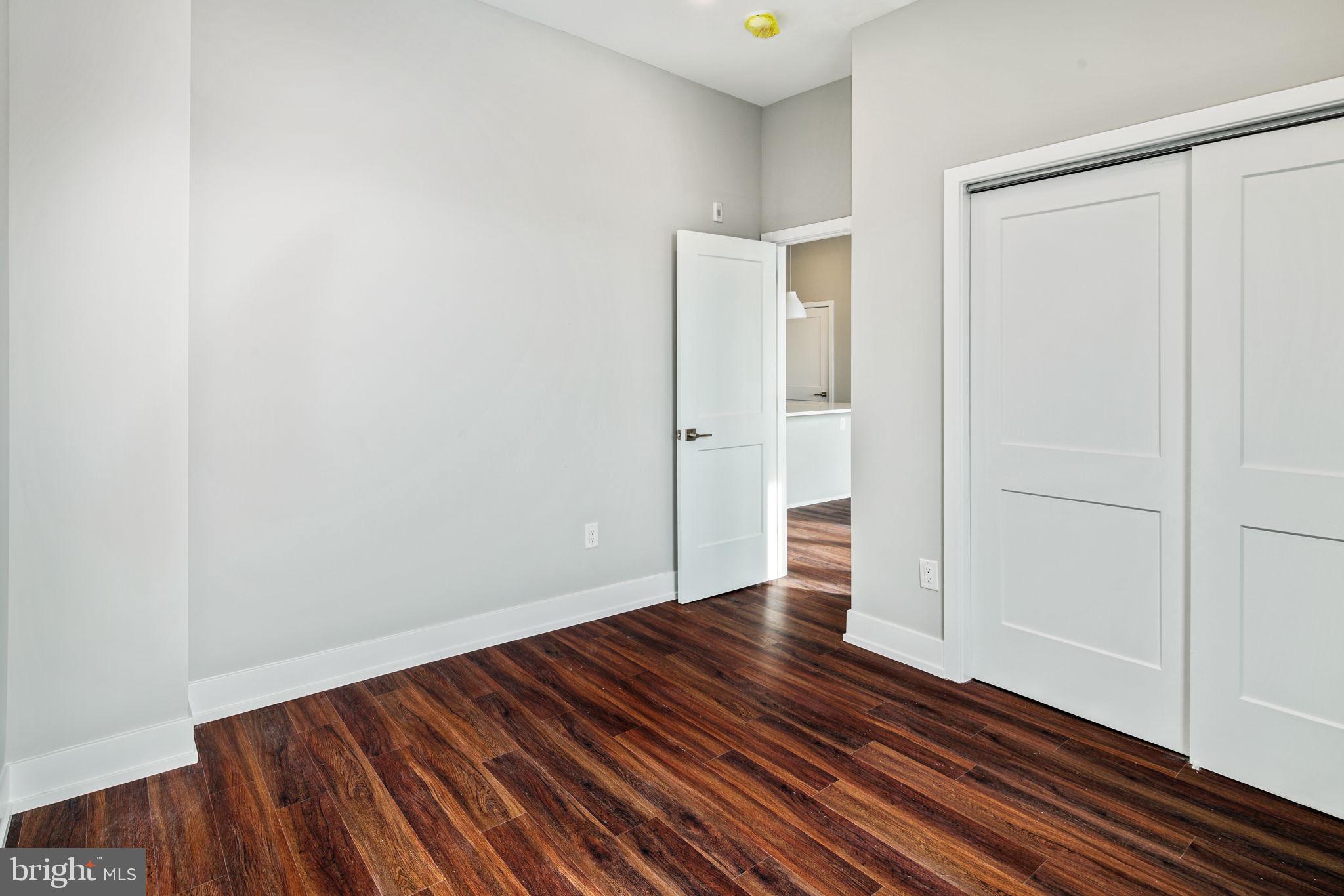 1527-29 Ridge Avenue, Unit 3A Philadelphia, PA 19130 - Photo 21 of 33 a view of an empty room with wooden floor