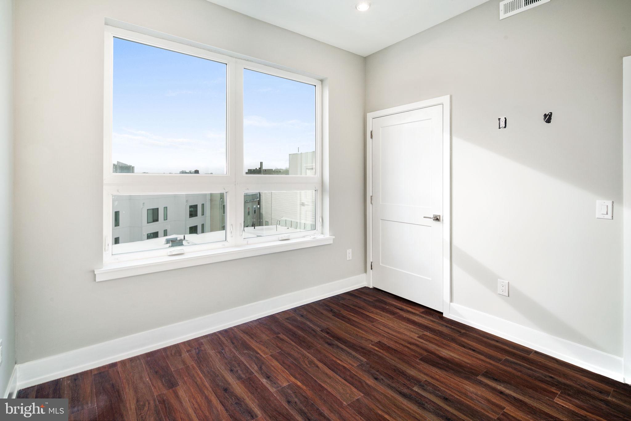 1527-29 Ridge Avenue, Unit 3A Philadelphia, PA 19130 - Photo 23 of 33 a bathroom with a sink and a mirror
